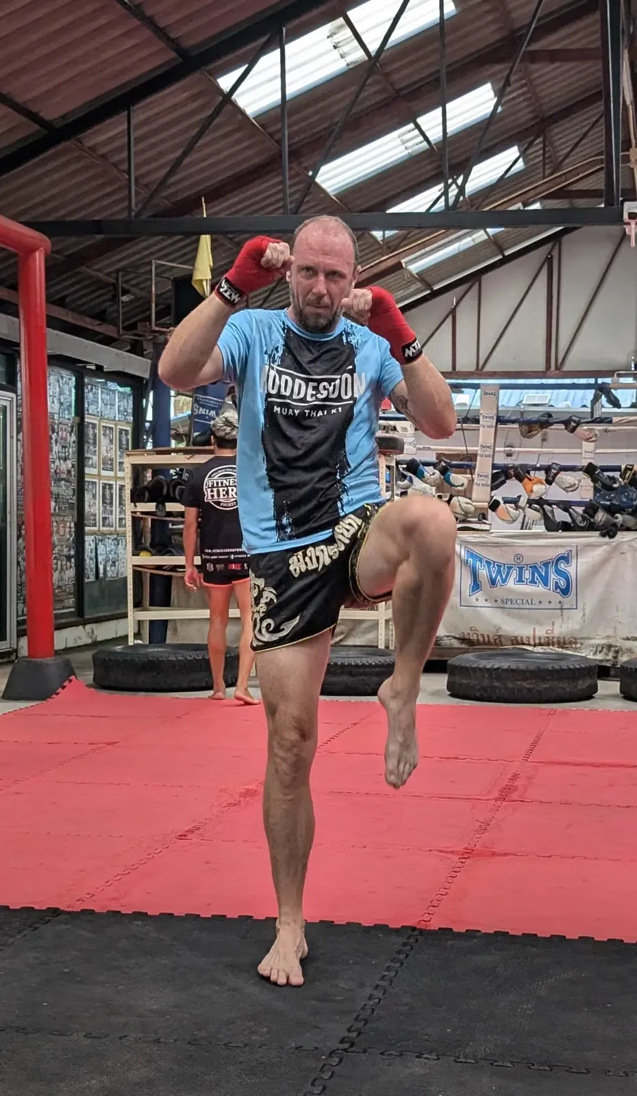 Fighter posing with a knee strike